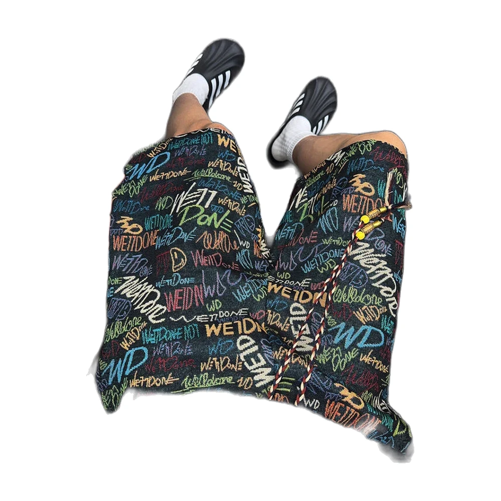 All-over graffiti print textured wide-leg shorts - garment view